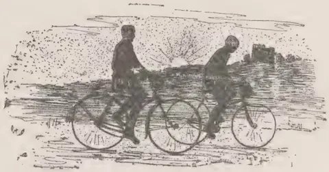 Two cyclists riding