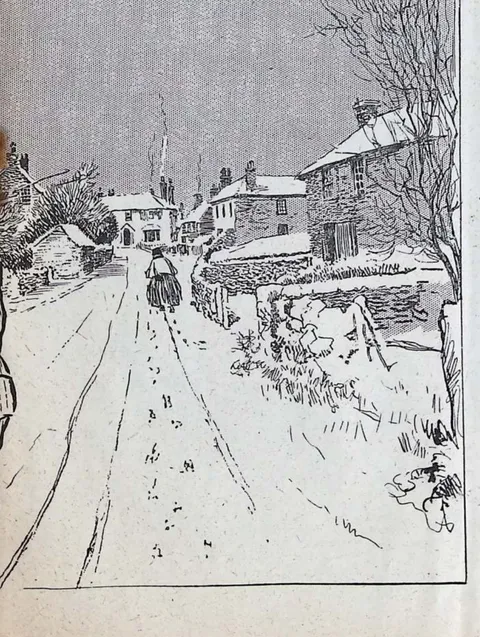 Snow-bound village lane with cyclist