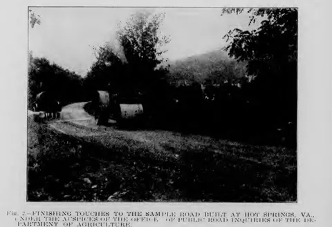 Finishing touches to the sample road built at Hot Springs, Va.